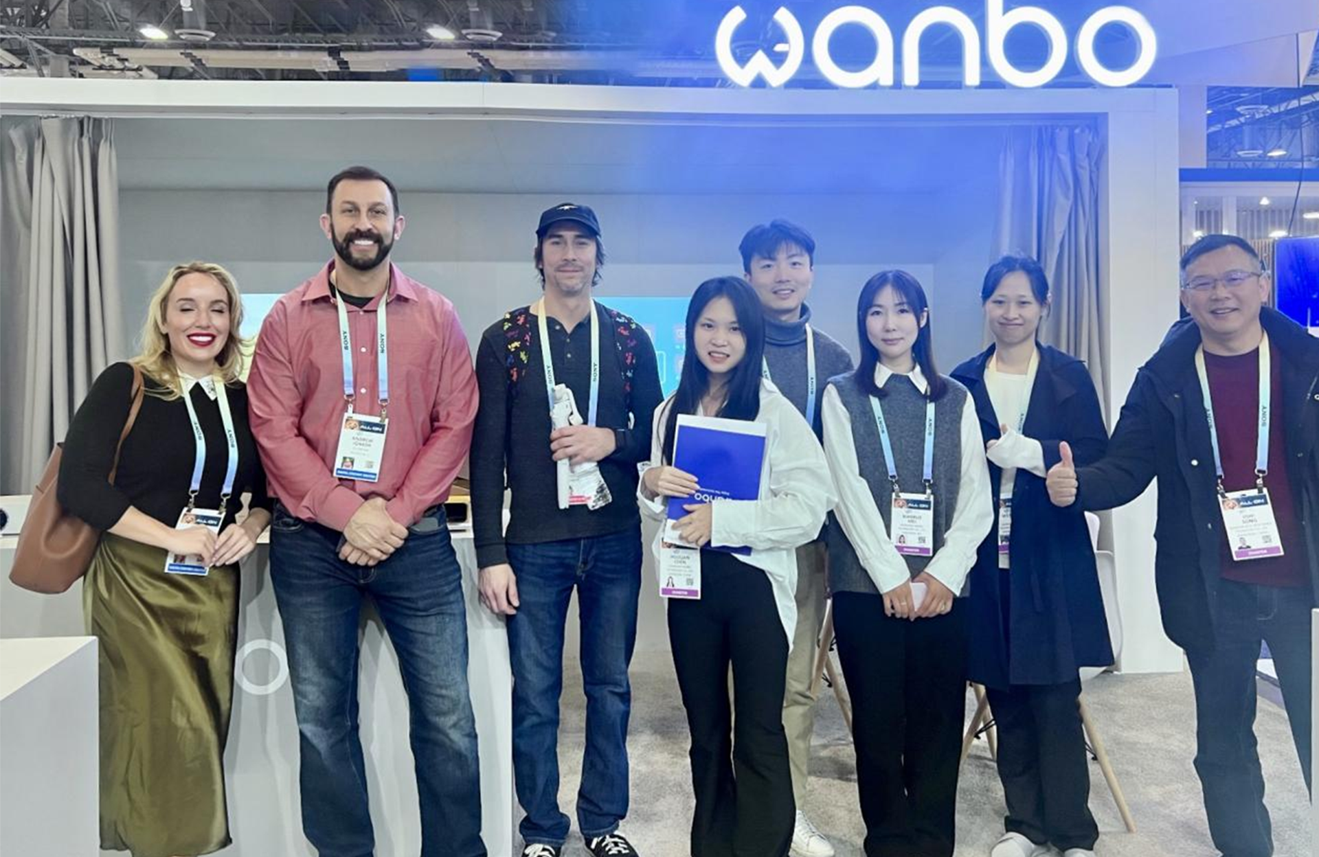 Wanbo team at CES 2024 booth.